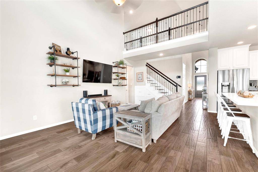 Extended living room with upgraded stair rails
