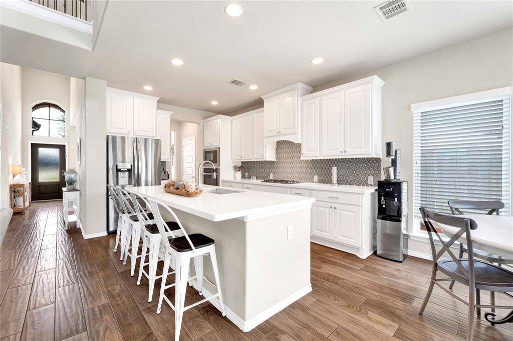 Additional seating at island with upgraded quartz counter tops
