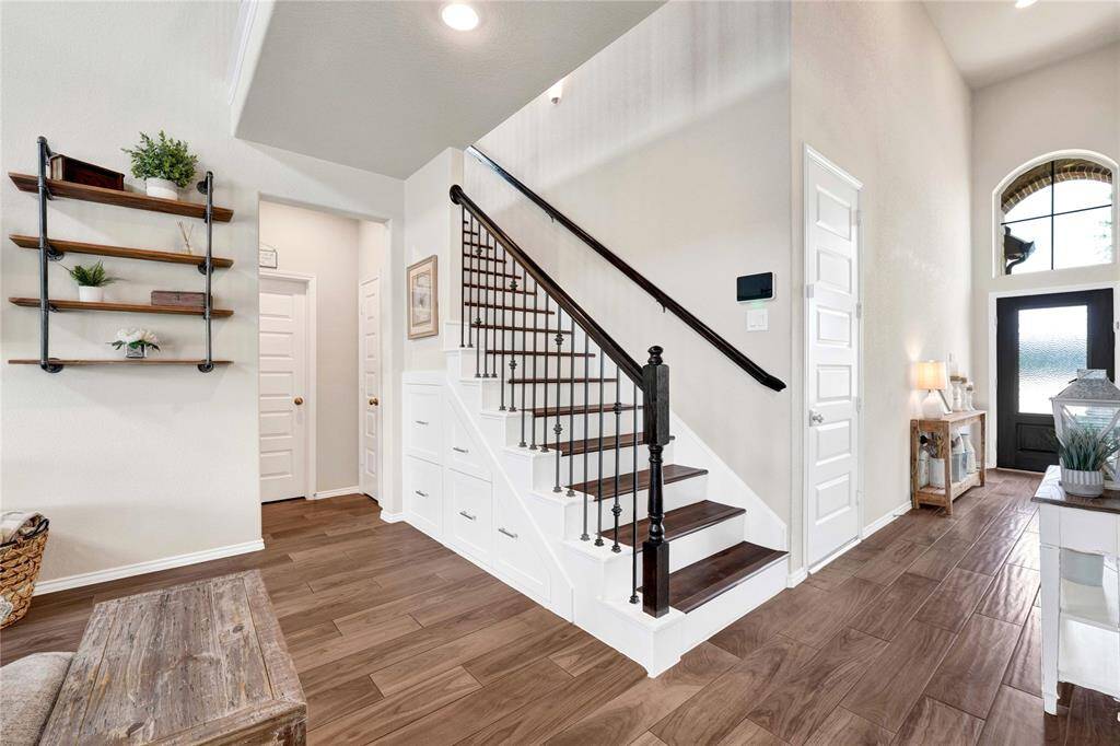 Classy Custom pull out storage drawers under stairs!