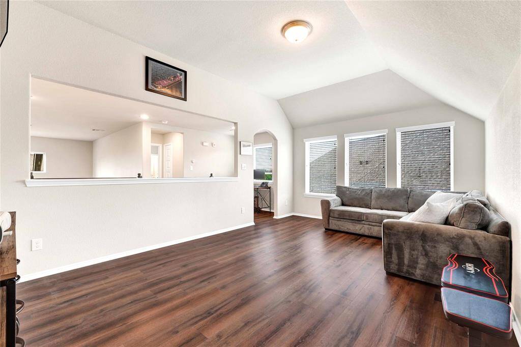 Privacy wall in loft area surrounded by three secondary bedrooms