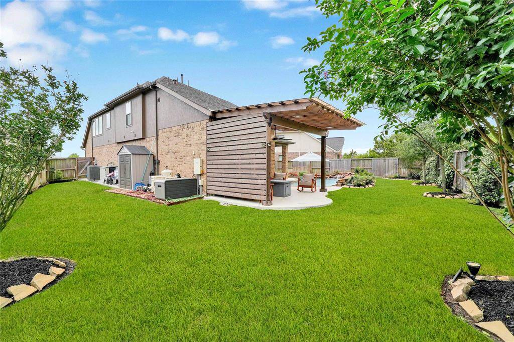 Full house gutters, Storage Shed, Generator with pad, and plenty of side yard for more backyard goals!