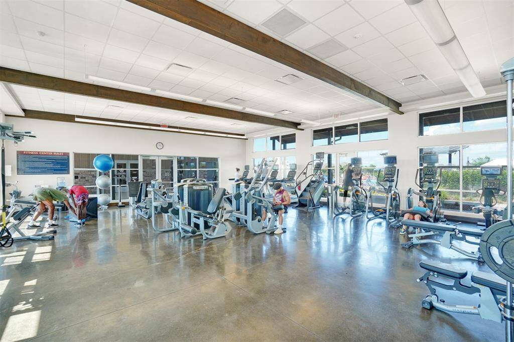 Fitness center with free weights, cardio machines, fitness classes, and strengthening machines