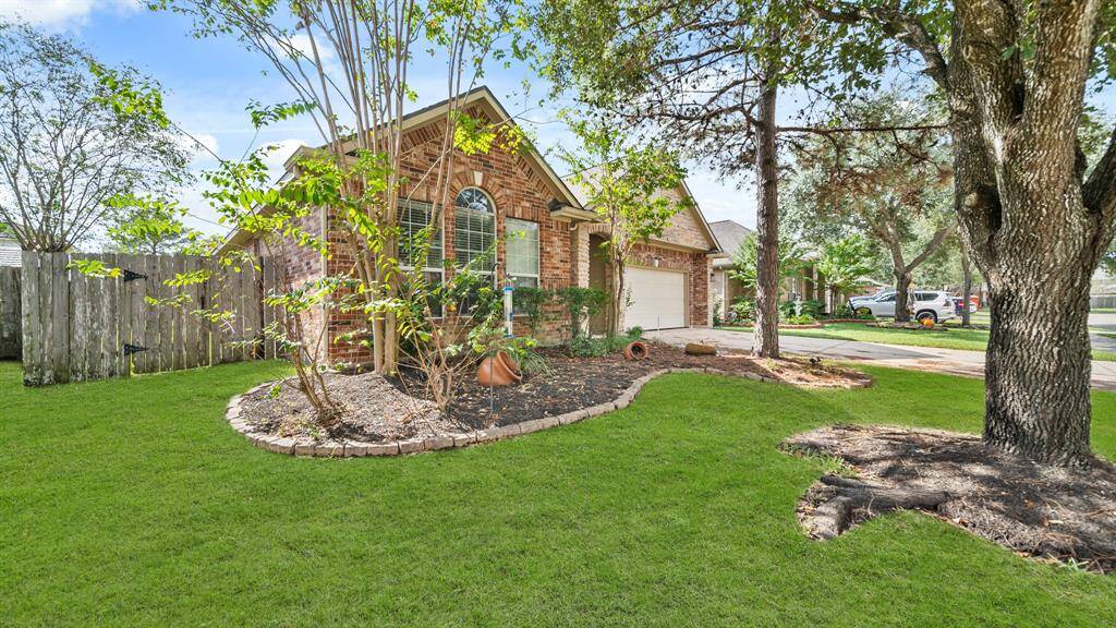 It features well maintained lawn, and a curbside appeal highlighted by beautiful bricks.