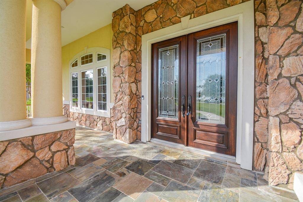 A bow to things natural, including a bevy of stunning stucco and stone applications, is an impressive hint of things to come, inside; where there are 5 bedrooms, 4 full and 2-half-baths. all sitting on a 34,429 square-foot-lot with 5,053 square-feet of interior living space.