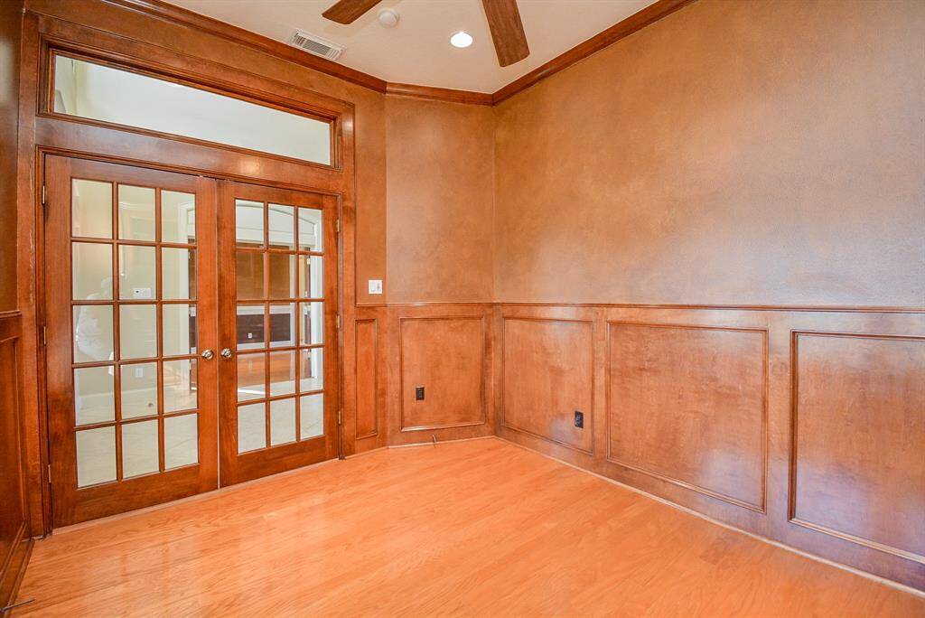 Classic, sophisticated french doors open onto this special study.