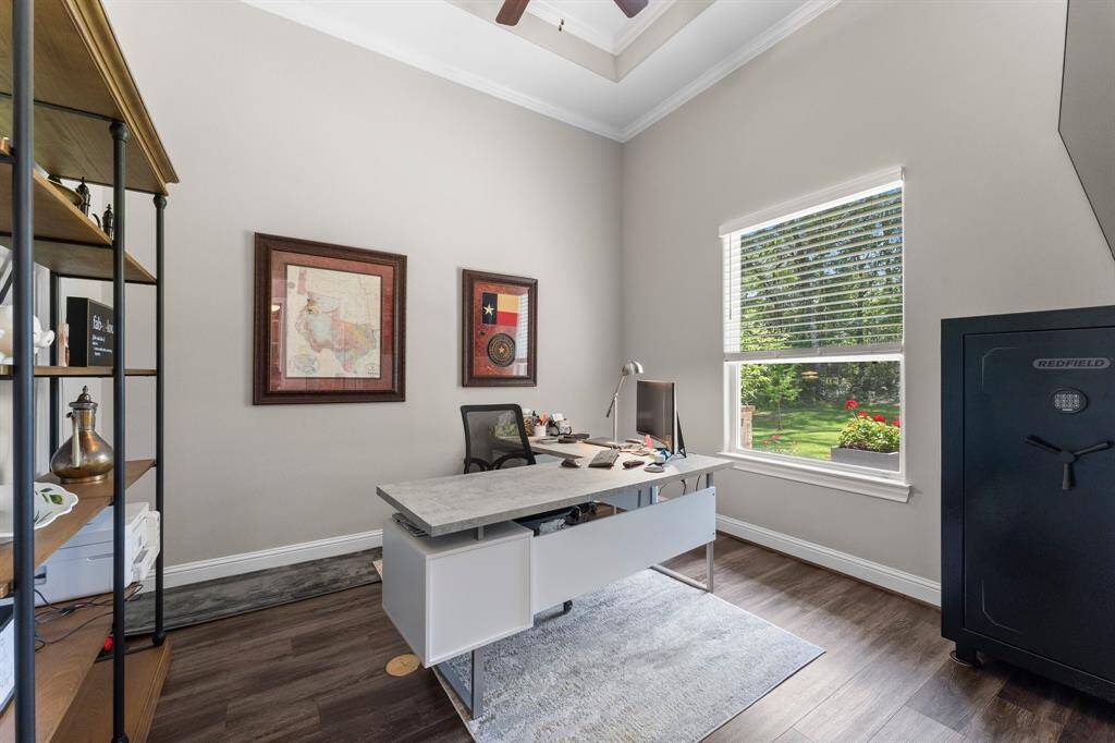 To the right of the entry is this home office/study/flex space with French doors for added privacy.  Enjoy your view of the stunning front yard while working or studying