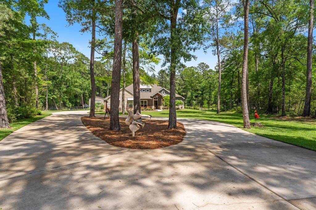 Nestled on a sprawling 3-acre lot, this property offers privacy and tranquility. Set back approximately 200 feet from the road, a graceful circular driveway is welcoming for you and your guests with easy access in and out of the property.