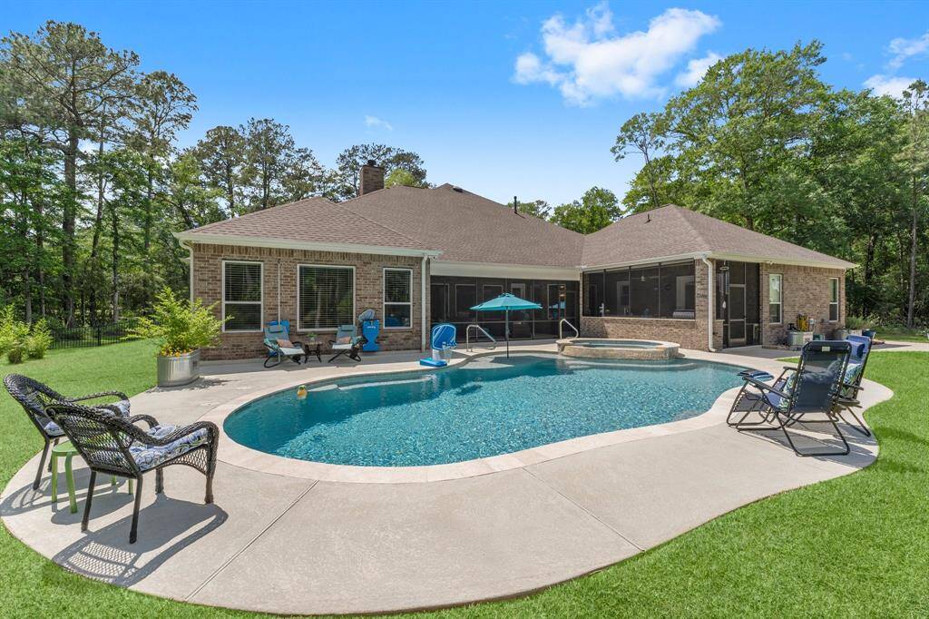 Your outdoor retreat awaits you!  This Pebble Tec pool and spa with chiller is designed to keep your pool water cool all summer long, while your pool heater will keep your pool and hot tub warm when the weather is cool!