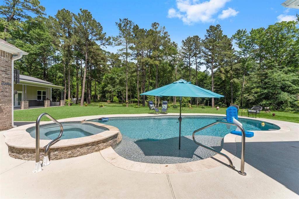 Imagine yourself lounging on the sundeck, cool drink in hand, basking in the shade of the umbrella while overlooking the tranquil beauty of your wooded view.