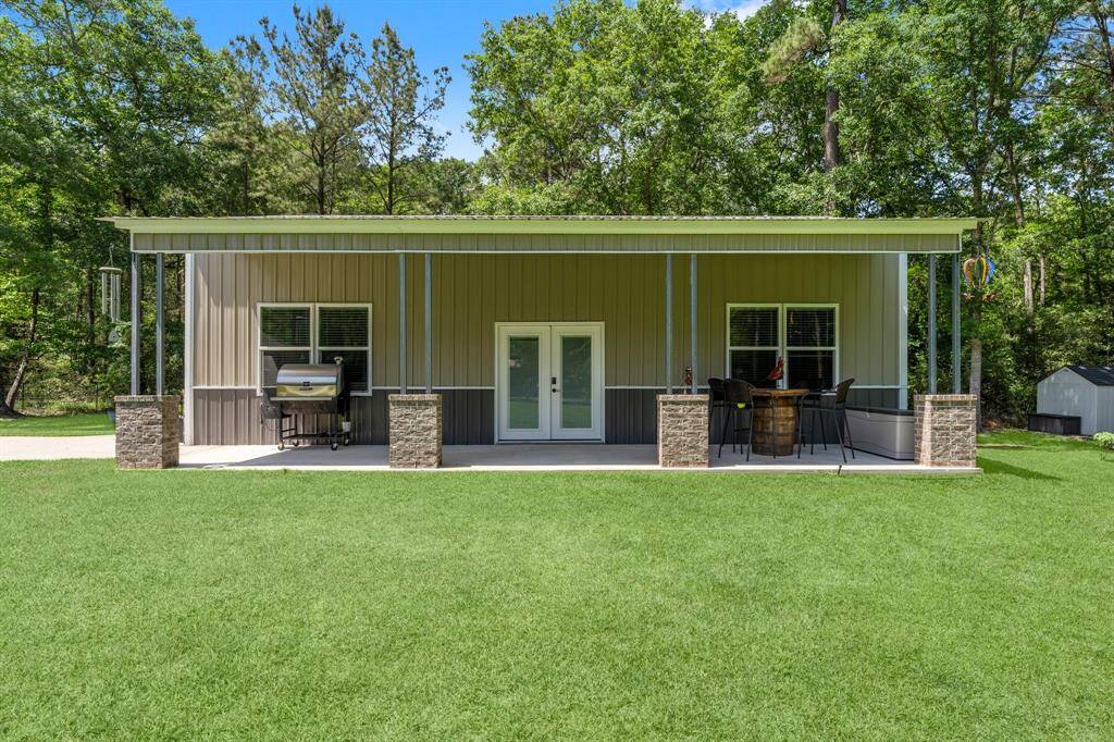 In addition to the oversize 3-car garage, discover a stylish and versatile 20' x 40' metal building, perfect for a workshop, studio, or hobbies. Complete with a large covered porch, this space adds significant value and flexibility to this already desirable home.