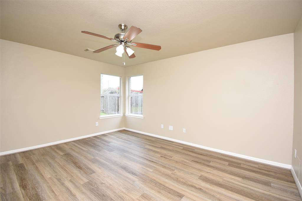 With a fan to keep the vibes just right and wood floors adding that perfect touch. Who's ready for some serious relaxation?