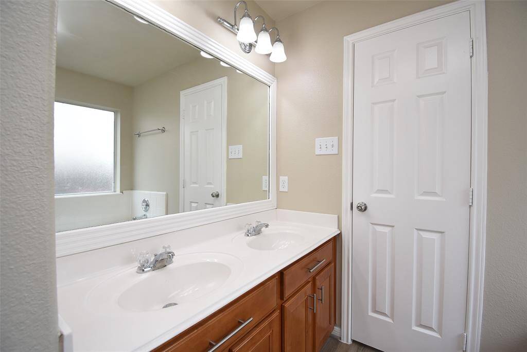 Double the style, double the sinks! Elevate your bathroom game with this dual sink setup.