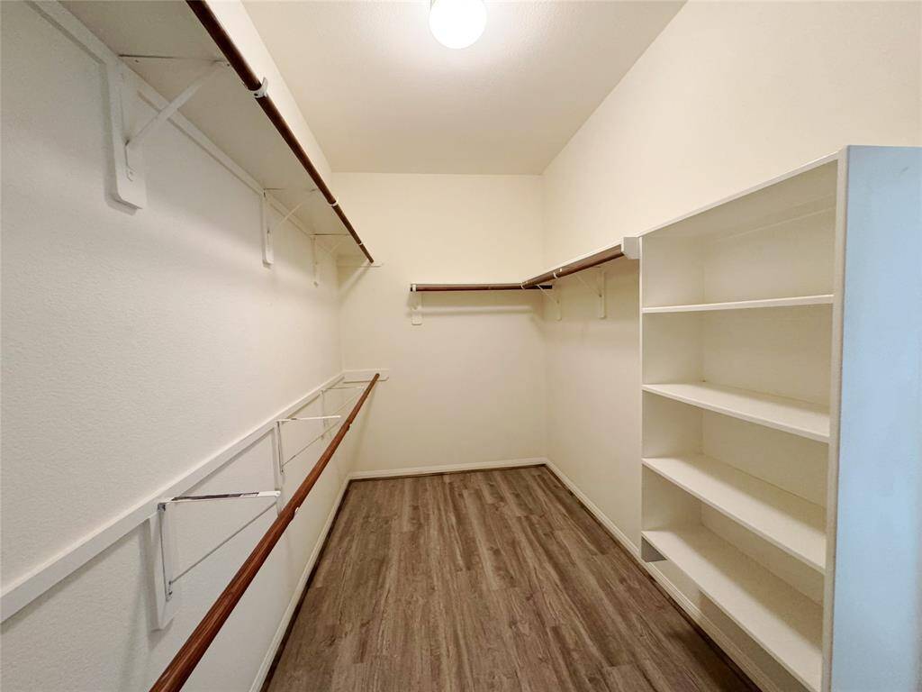 Large walk-in closet in primary suite
