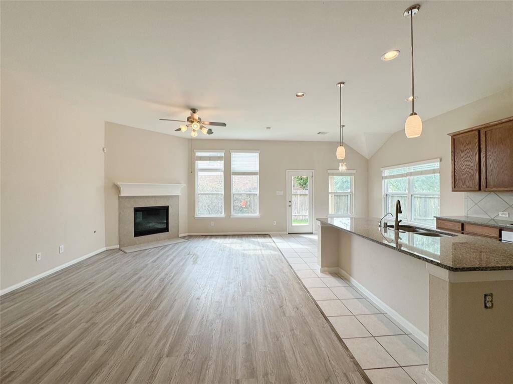 Granite kitchen opening to living room