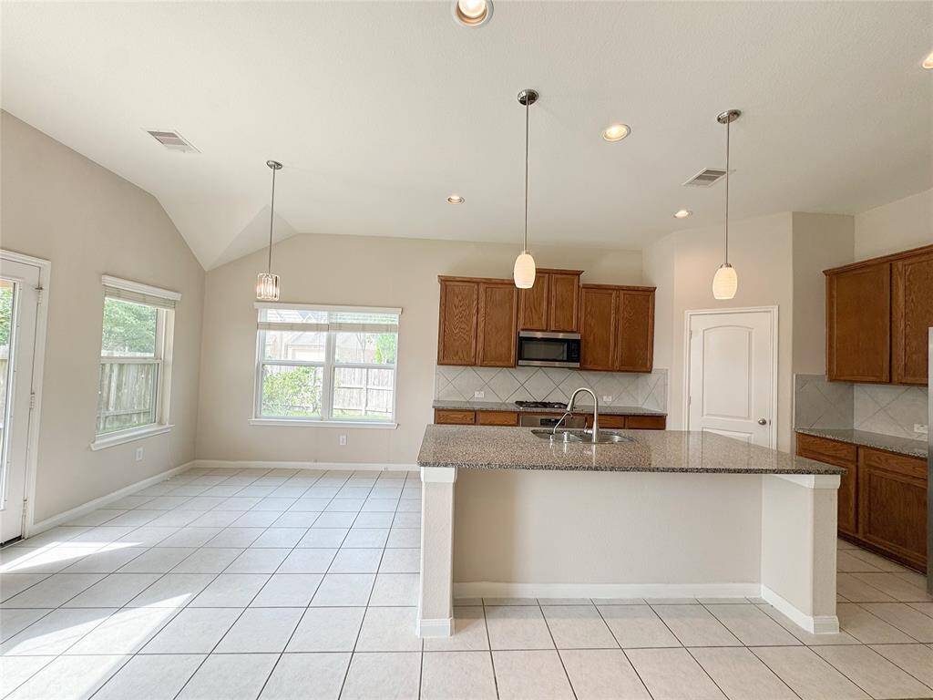 Granite kitchen opening to living room