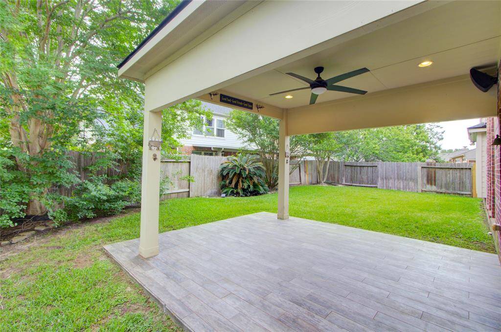 Nice Back Yard, covered Patio with fan and floor to relax in style.