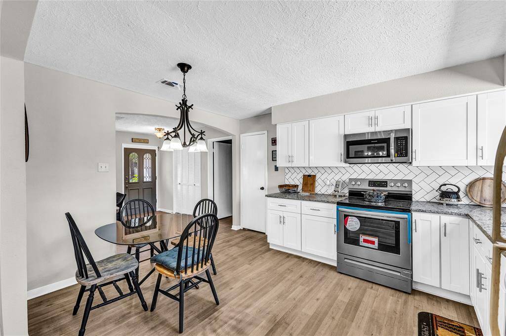 Beautiful open kitchen with all new appliances, cabinets, hardware & countertops. All updated 2024
