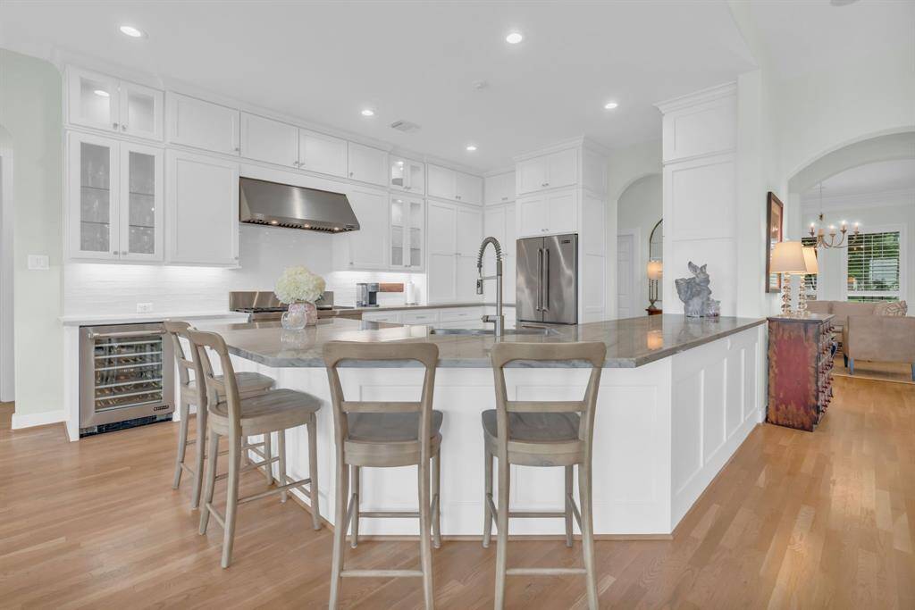 Your family & friends can join you while seated at the breakfast bar as you prepare delicious entrees. The wine cooler completes the kitchen to perfection! 27103 Boater's Crossing Dr., Katy, TX  77493