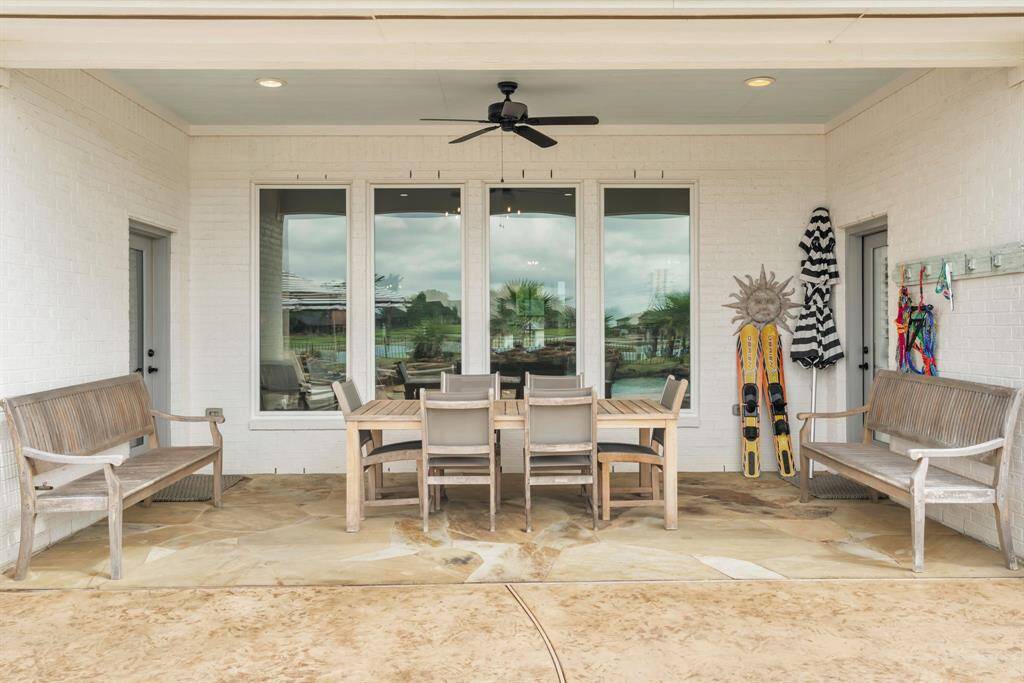 Covered Patio, Ceiling Fan, Gutters Installed around perimeter of the home, Irrigation System! 27103 Boater's Crossing Dr., Katy, TX  77493