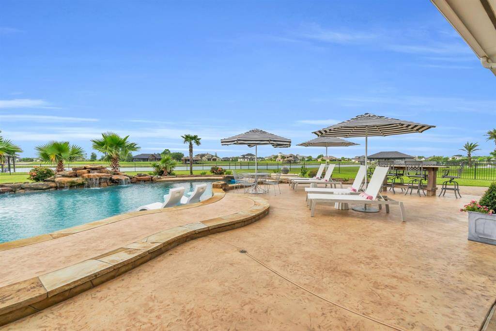 Flagstone Coping with Colored Concrete Pool Decking and Walkways! 27103 Boater's Crossing Dr., Katy, TX  77493