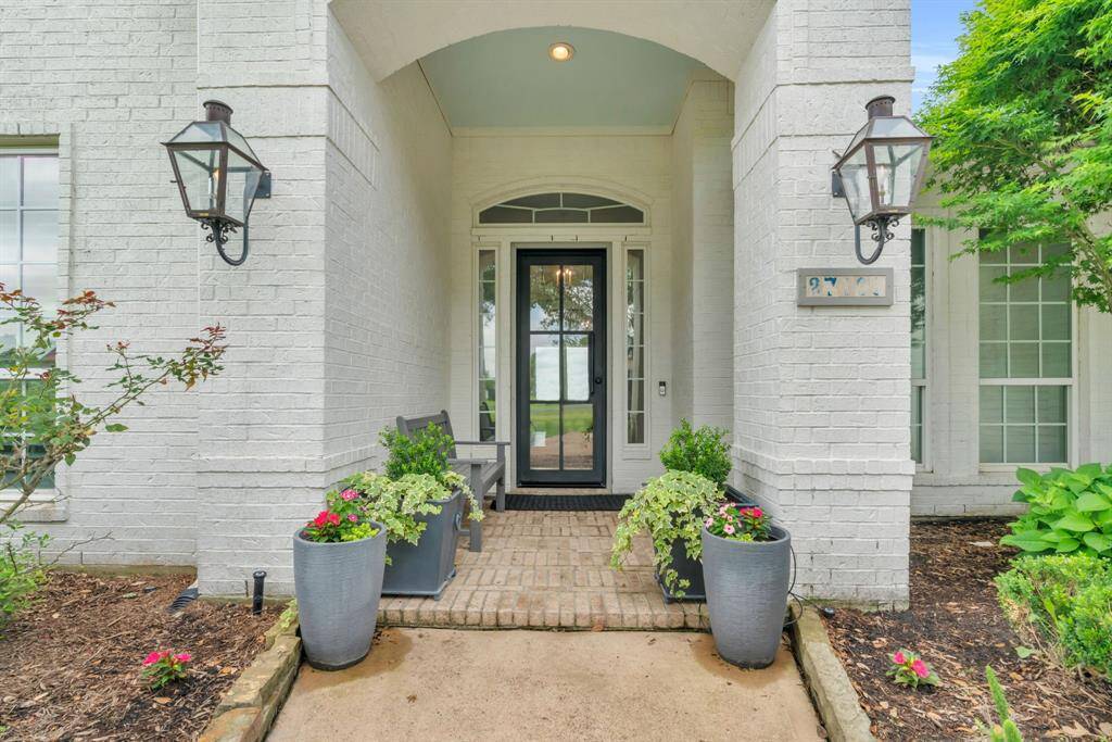 Beautiful Gas Lanterns & a 8' Glass & Metal Door welcomes You & Your Guests! 27103 Boater's Crossing Dr., Katy, TX 77493