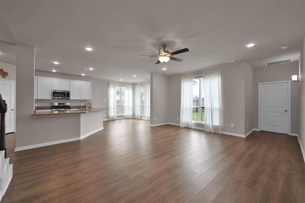 View of the kitchen and living area from the half bath downstairs