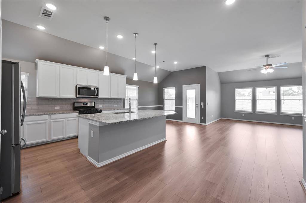 Enjoy company and entertainment while cooking in this massive kitchen.