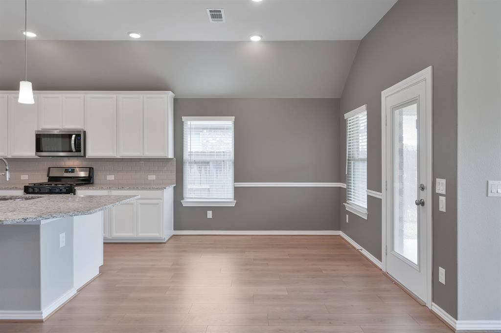 Both counter bar seating and space for a traditional dining table.