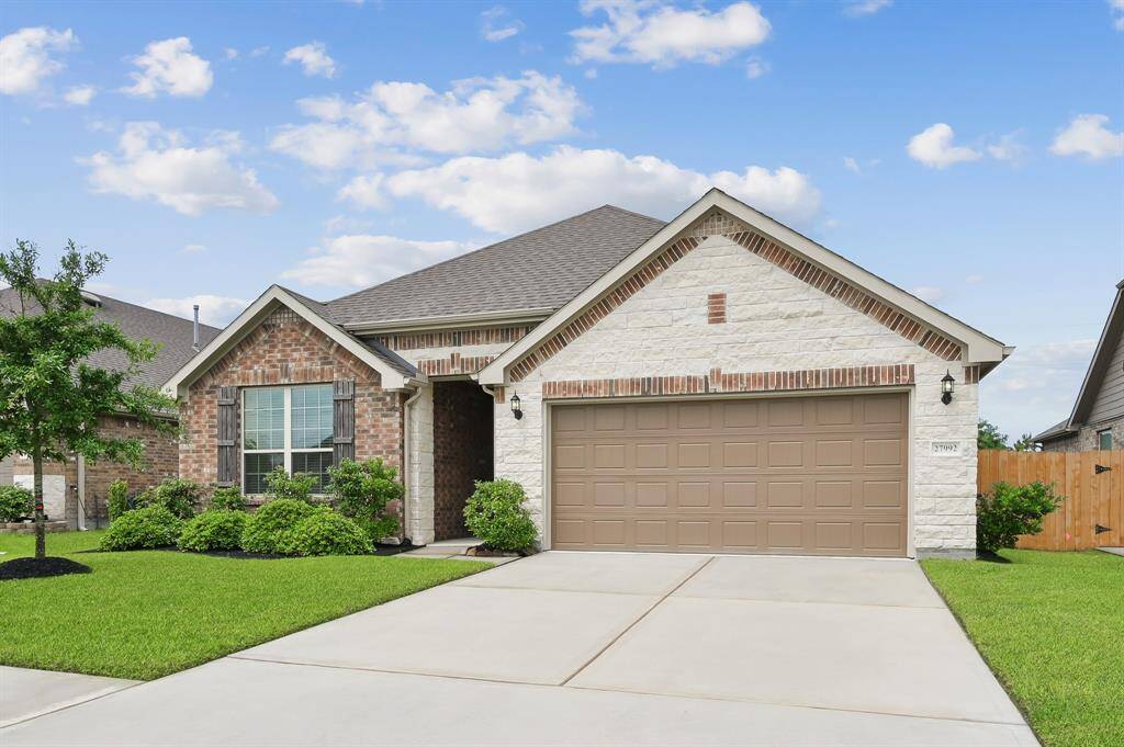 Gorgeous elevation featuring beautifully. groomed lanscaping