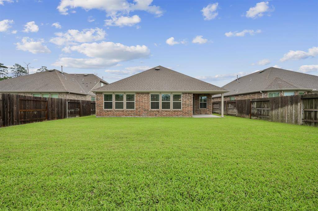 Large backyard is a clean slate for making beautiful memories in your new home.