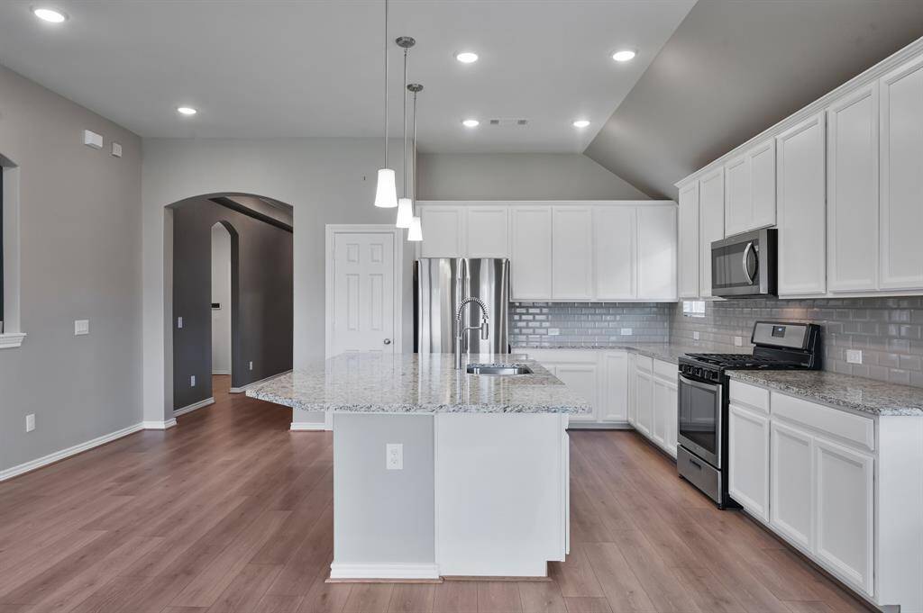 Beautiful countertops, cabinetry, and spacious pantry - kitchen storage for days!