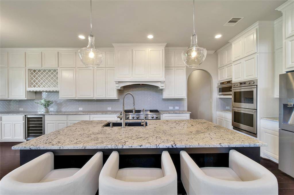 Breakfast bar with view of custom cabinetry.