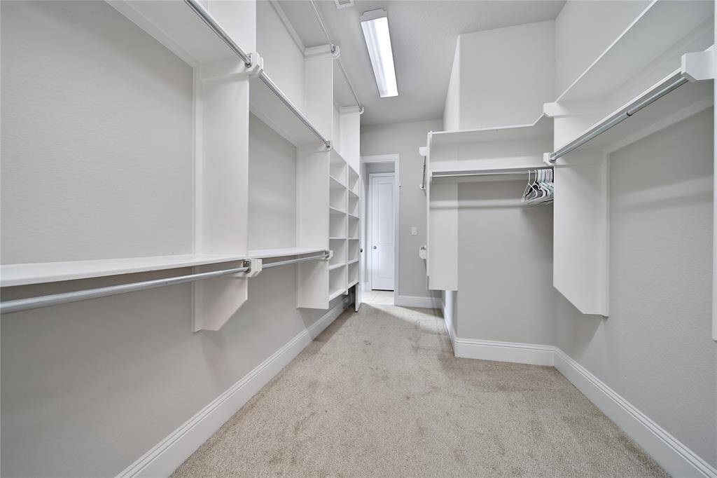 Hollywood style primary closet.