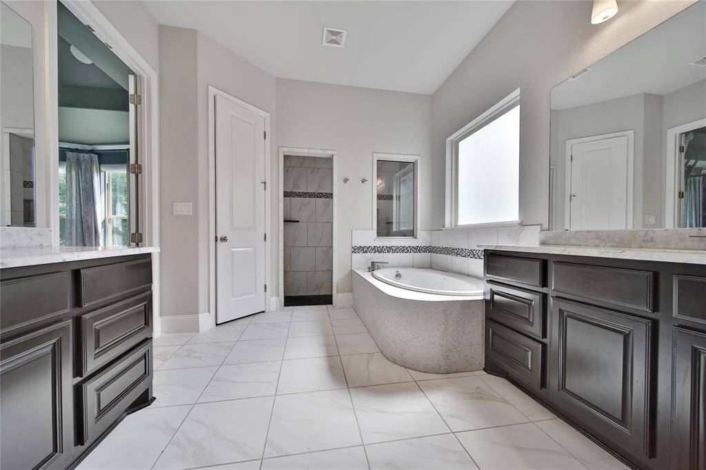 Primary bathroom has two closets.