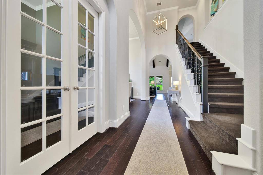 Beautiful grand entry with executive office to the left upon entering the home.
