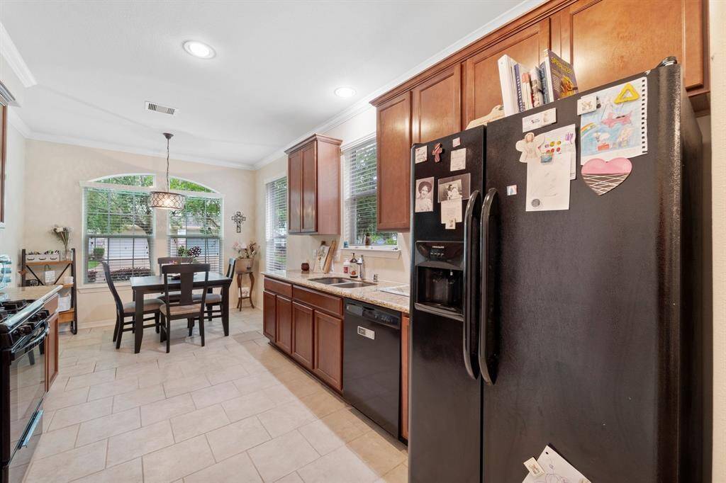 Additional view of kitchen and included Refridgerator