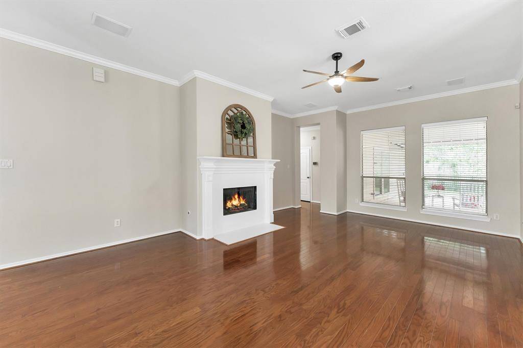 Living room is open to the kitchen and dining areas.