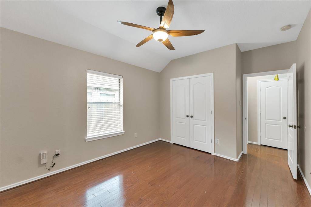 Another view of this bedroom with good sized closet. In front is a hall closet and to the left in the hallway is the laundry room.