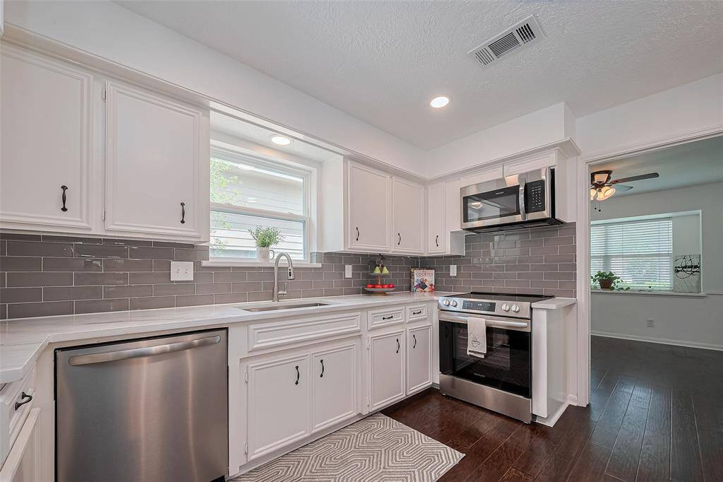 Another view of the kitchen offering natural and bright light.