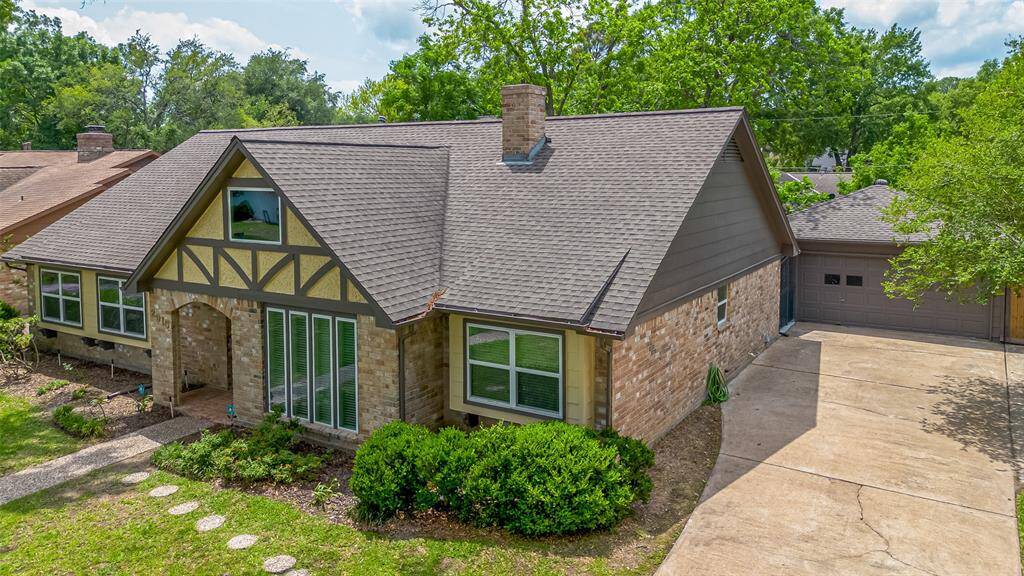 Generous driveway with a detached two-car garage, offering plenty of parking and storage space