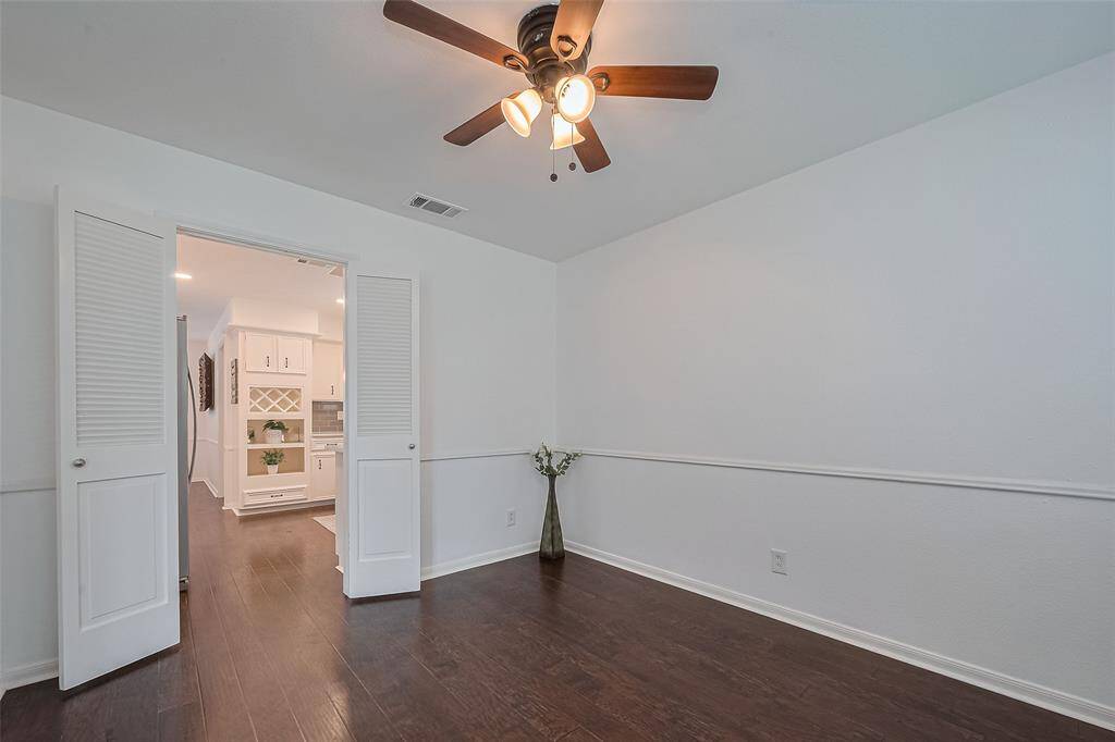 Another versatile space by the kitchen perfect for use as a home office or cozy lounge.