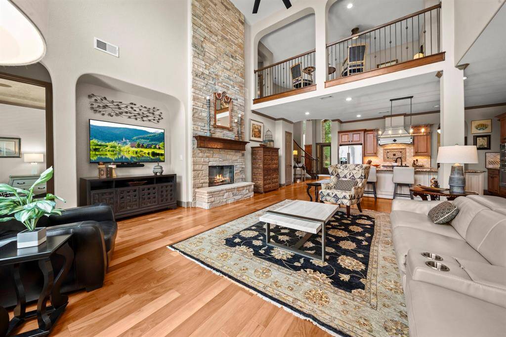The den is open to the upstairs landing area