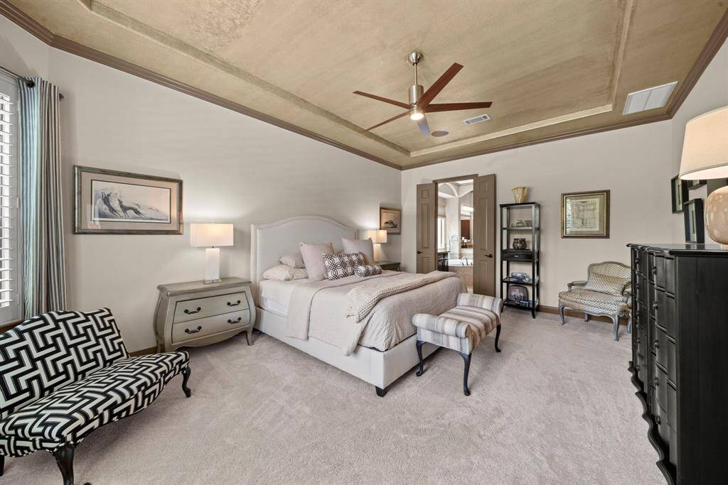 With custom paint and a raised tray ceiling, this room is spacious and relaxing