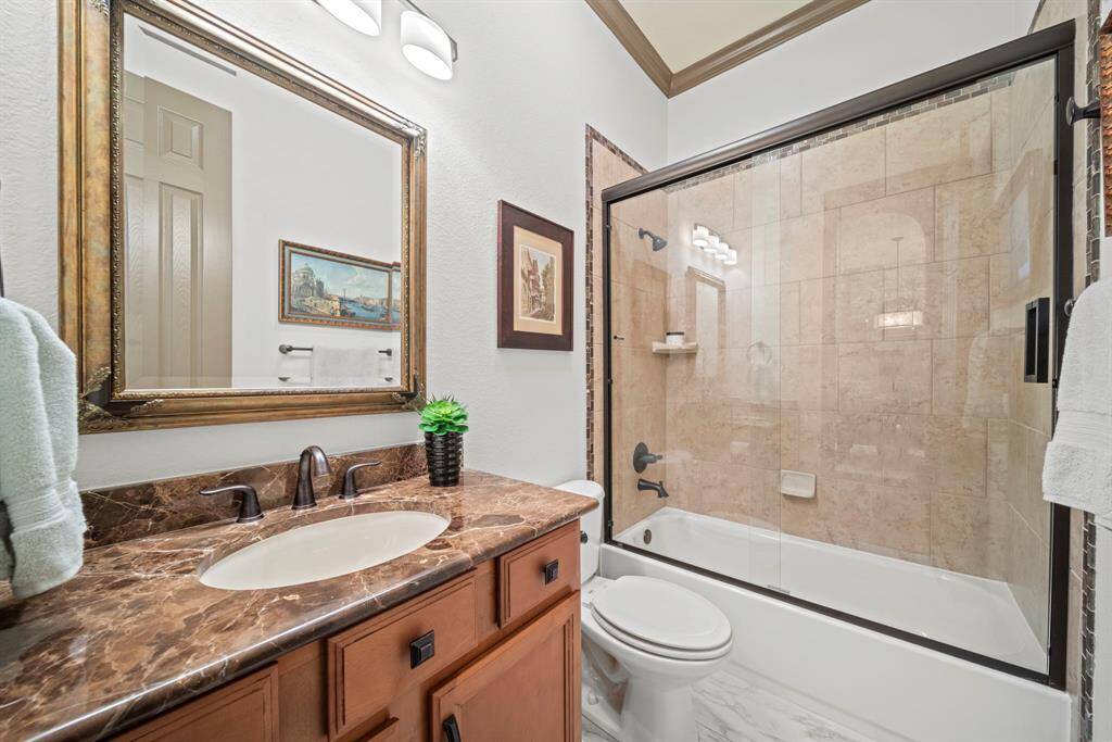 The full bath down has a shower/tub combo with superior granite and tile flooring