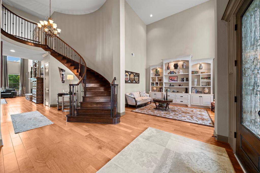 The open entry is fresh and inviting with wood laminate floors