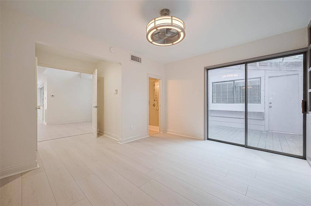 The secondary bedroom downstairs has private access to the full bathroom and it's own private courtyard.  Great for guests or a home office.