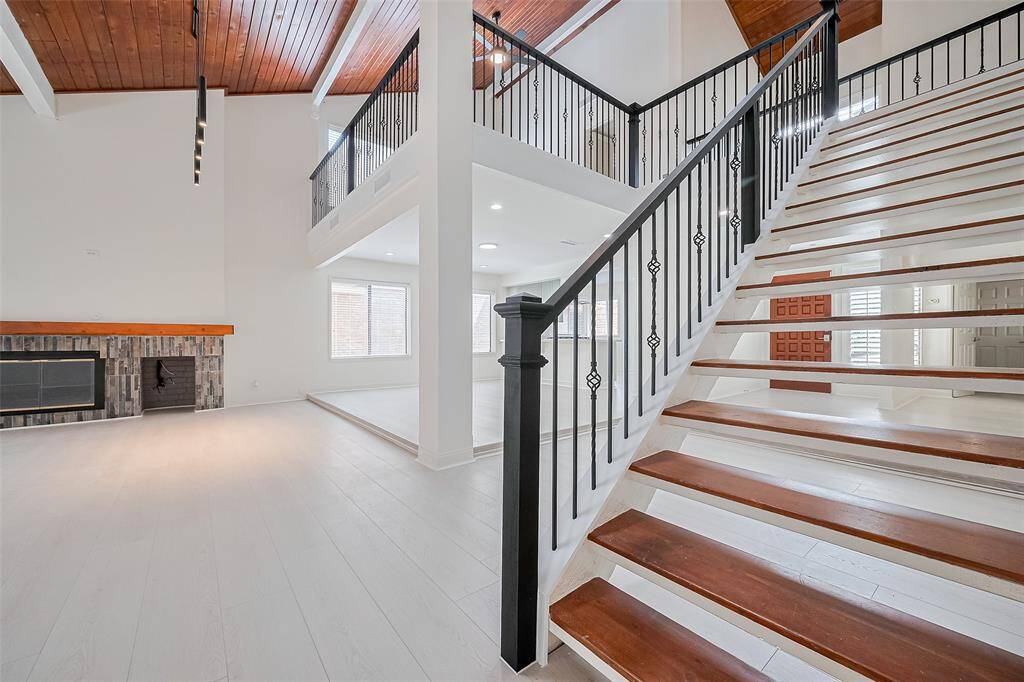 The primary suite is tucked away at the back of the house beside the staircase.