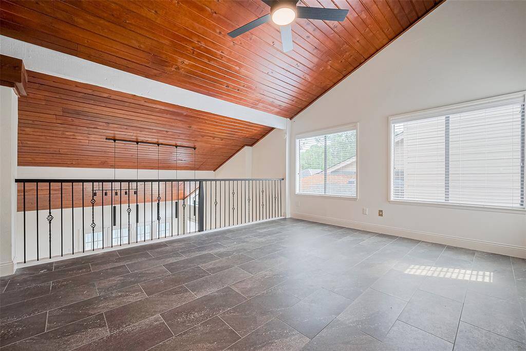 The upstairs loft space is so versatile overlooking the downstairs living area.