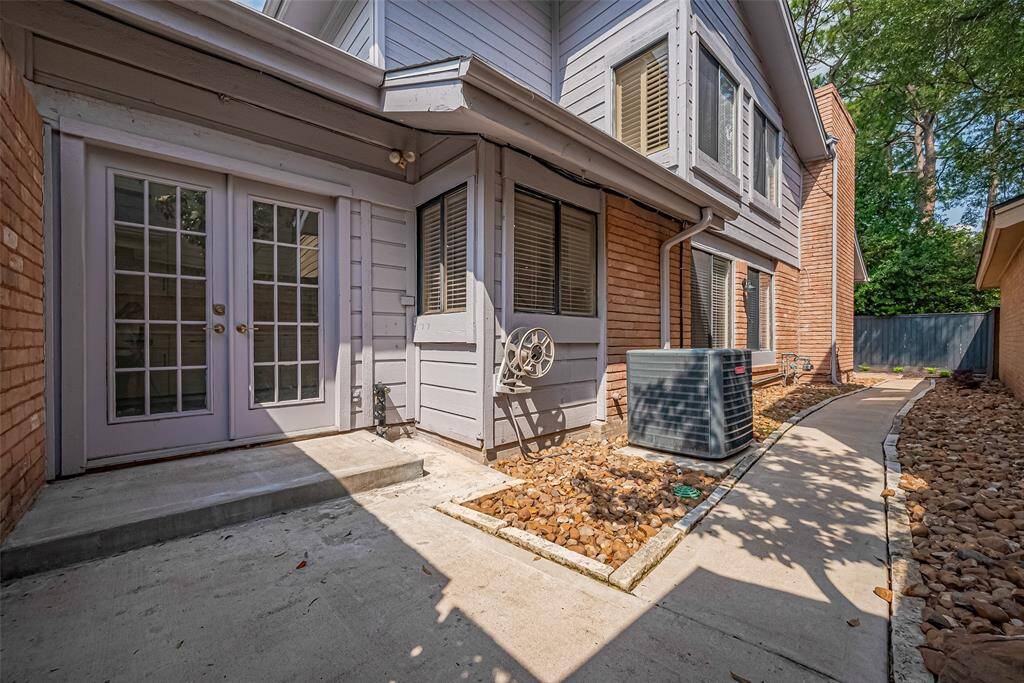 French doors to the breakfast area and walkway to the back patio down the side yard of the house.