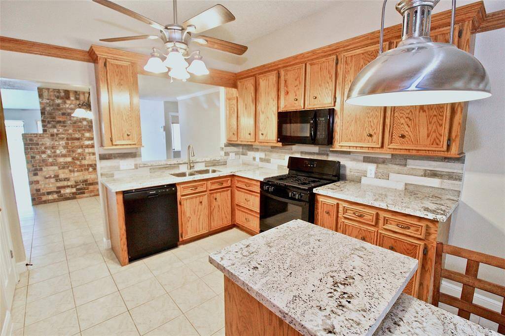 Beautiful updated kitchen with custom made cabinets, granite countertops and beautiful backsplash."Currently Occupied"